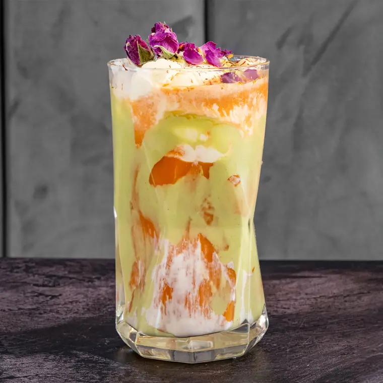 Havij bastani — carrot juice with ice cream, topped with edible flowers.
